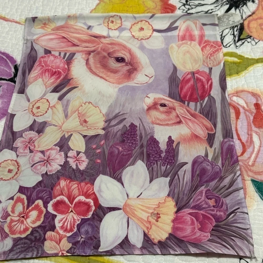 Cute mommy & baby bunny hiding in a garden flag.